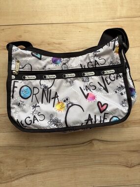 LeSportsac Silver Graphic Travel Print Crossbody with Black Trim